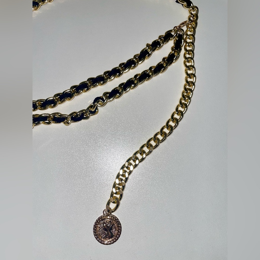 Chain belt with charm.